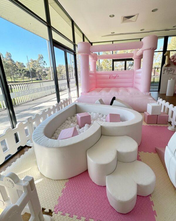 The Ultimate Pink Package all pink and white jumping castle and soft play with ball pit.