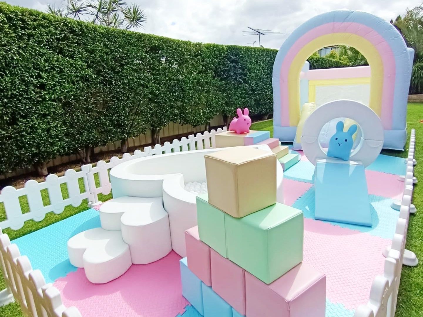 The Lux Rainbow jumping castle and Soft Play package.