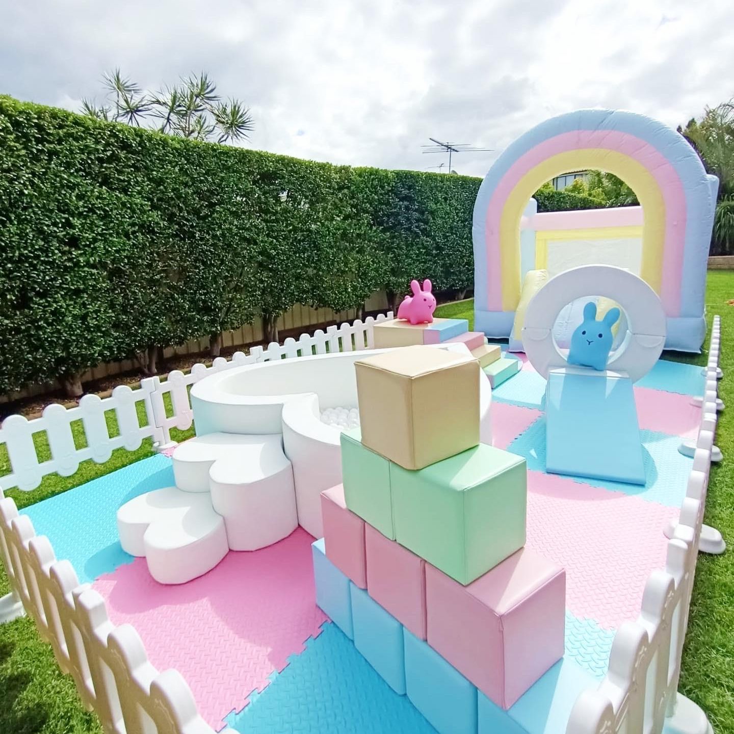 The Lux Rainbow jumping castle and Soft Play package.