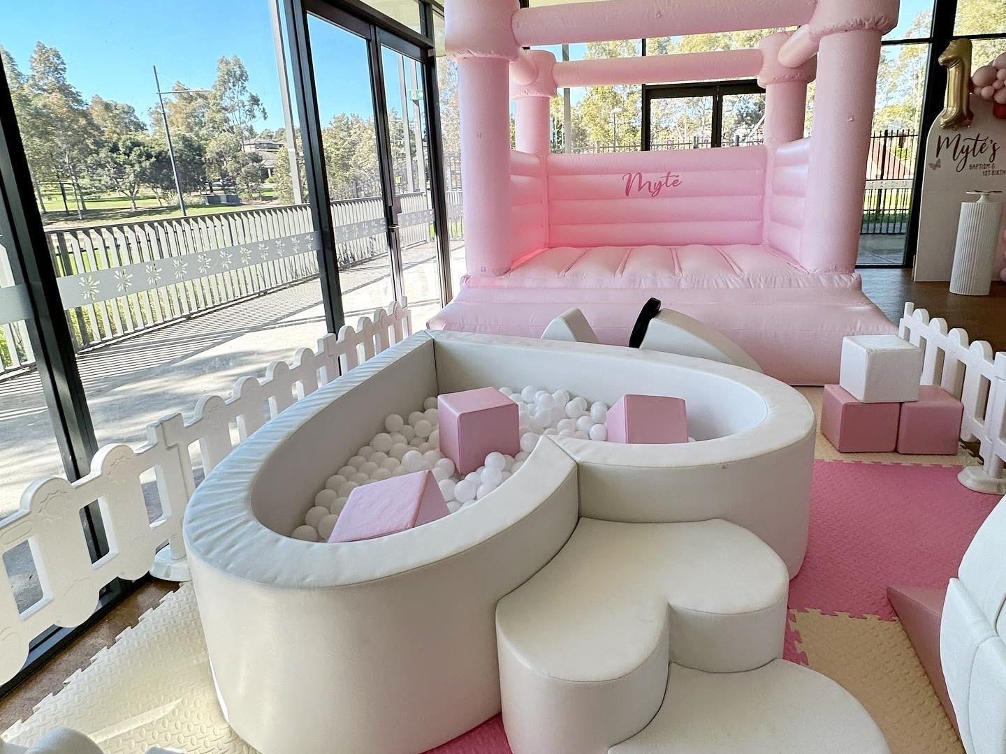 The Ultimate Pink Package all pink and white jumping castle and soft play with ball pit.